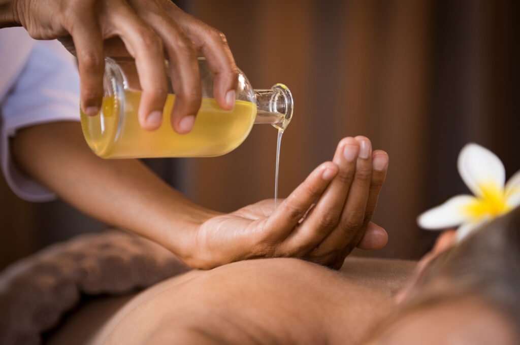 Massage oil being poured for an add-on treatment