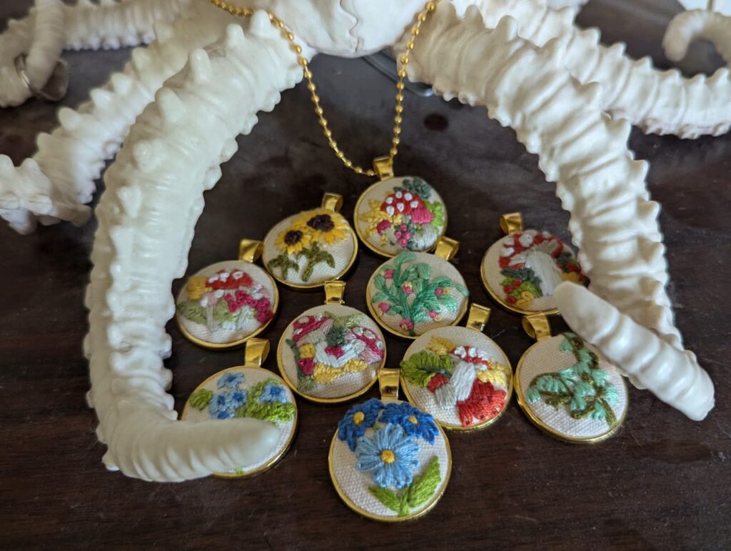 Handmade fiber art pendants by Black Cat Alchemy