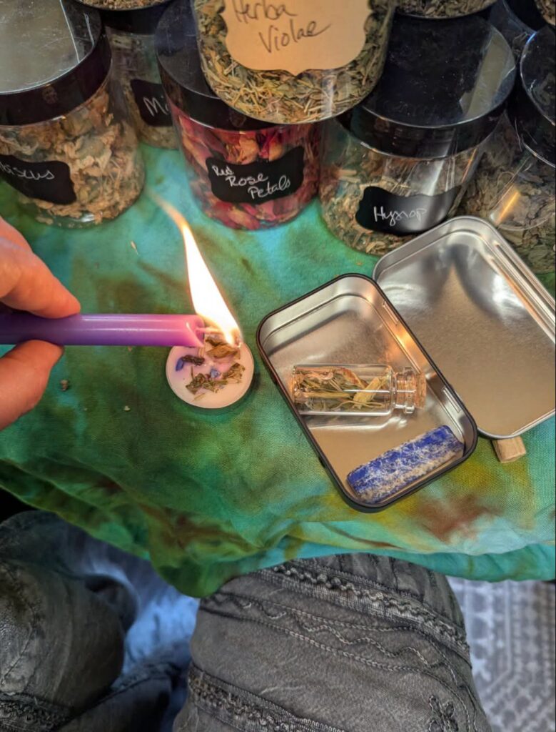 A Black Cat Alchemy spell kit being lit