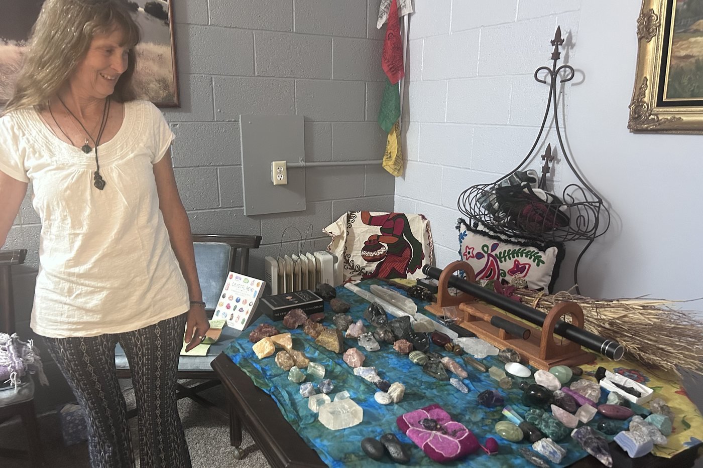 Danita Sayers with her table of crystals and stones