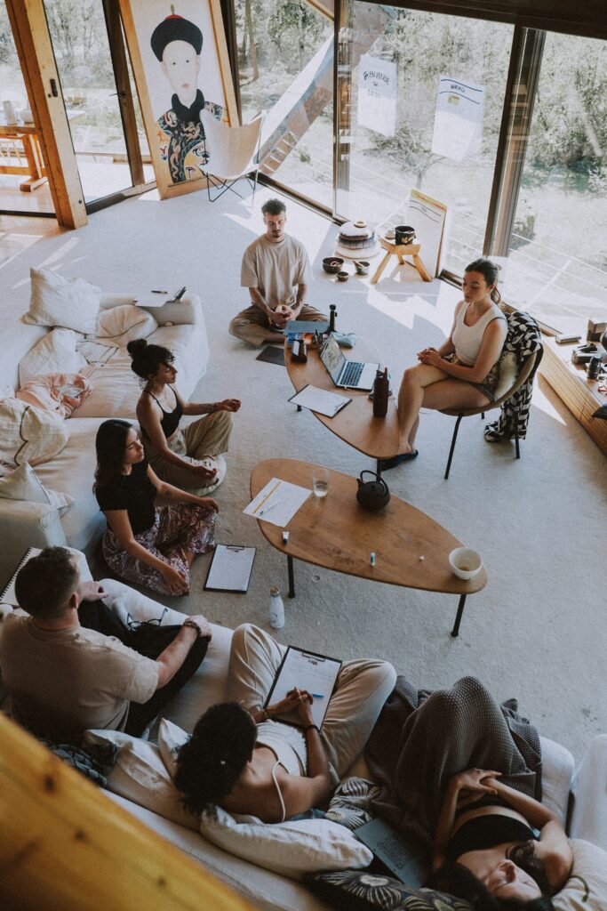A small group gathered in a bright room