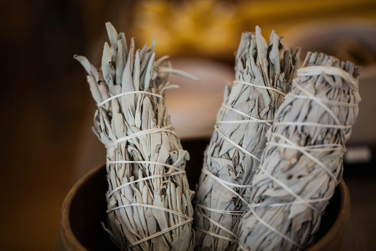 Dried sage bundles in a jar