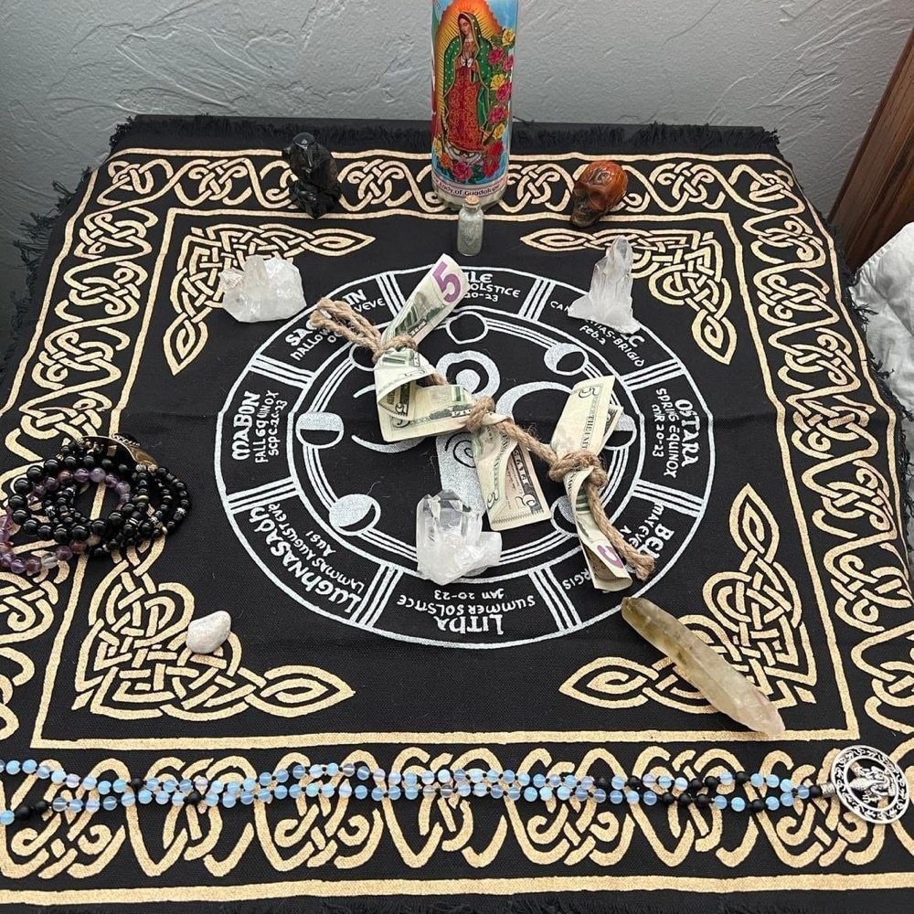 Ceremonial altar cloth with candle, crystals and offerings