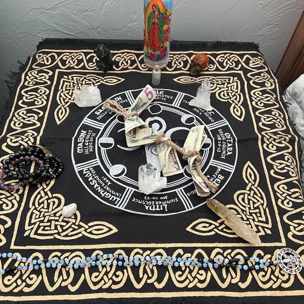 Ceremonial altar cloth with candle, crystals and offerings